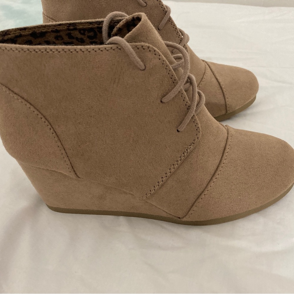 New without tags. Women wedge booties. Size 7